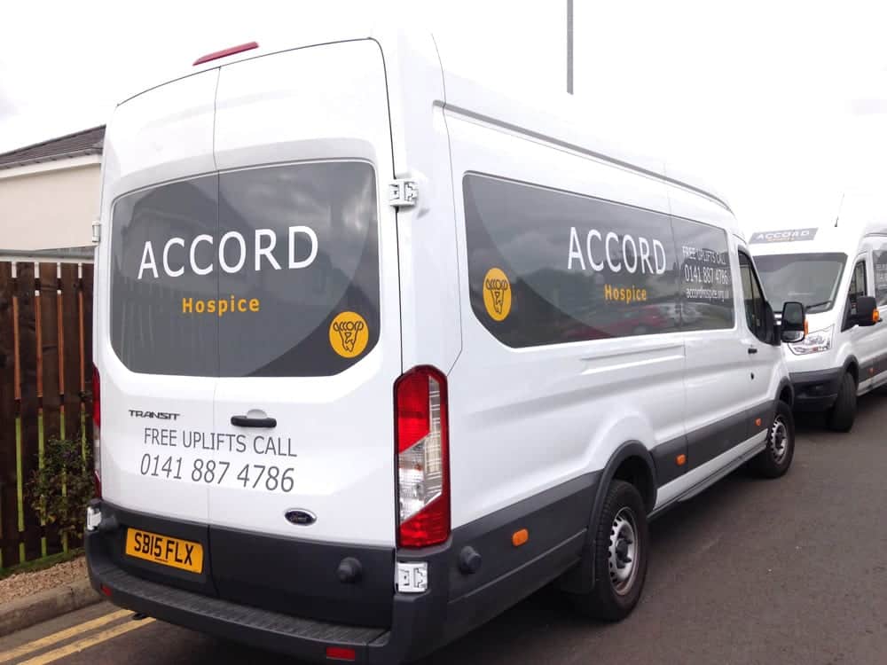 White ACCORD Hospice van with the grey ACCORD logo and yellow Hospice lettering