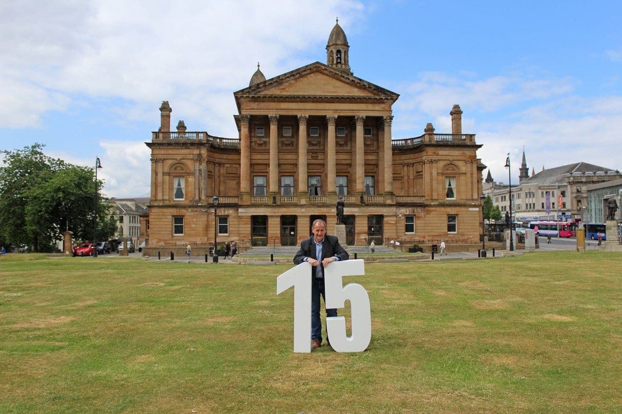 David from CO2 Design celebrating 15 years of the studio with a large 15 sign