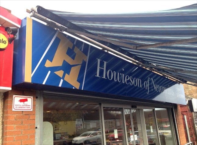 Howieson of Newmains shop front with the new navy H logo on the awning