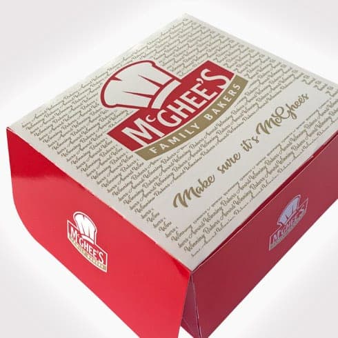 Red and cream McGhee’s cake box with script lettering