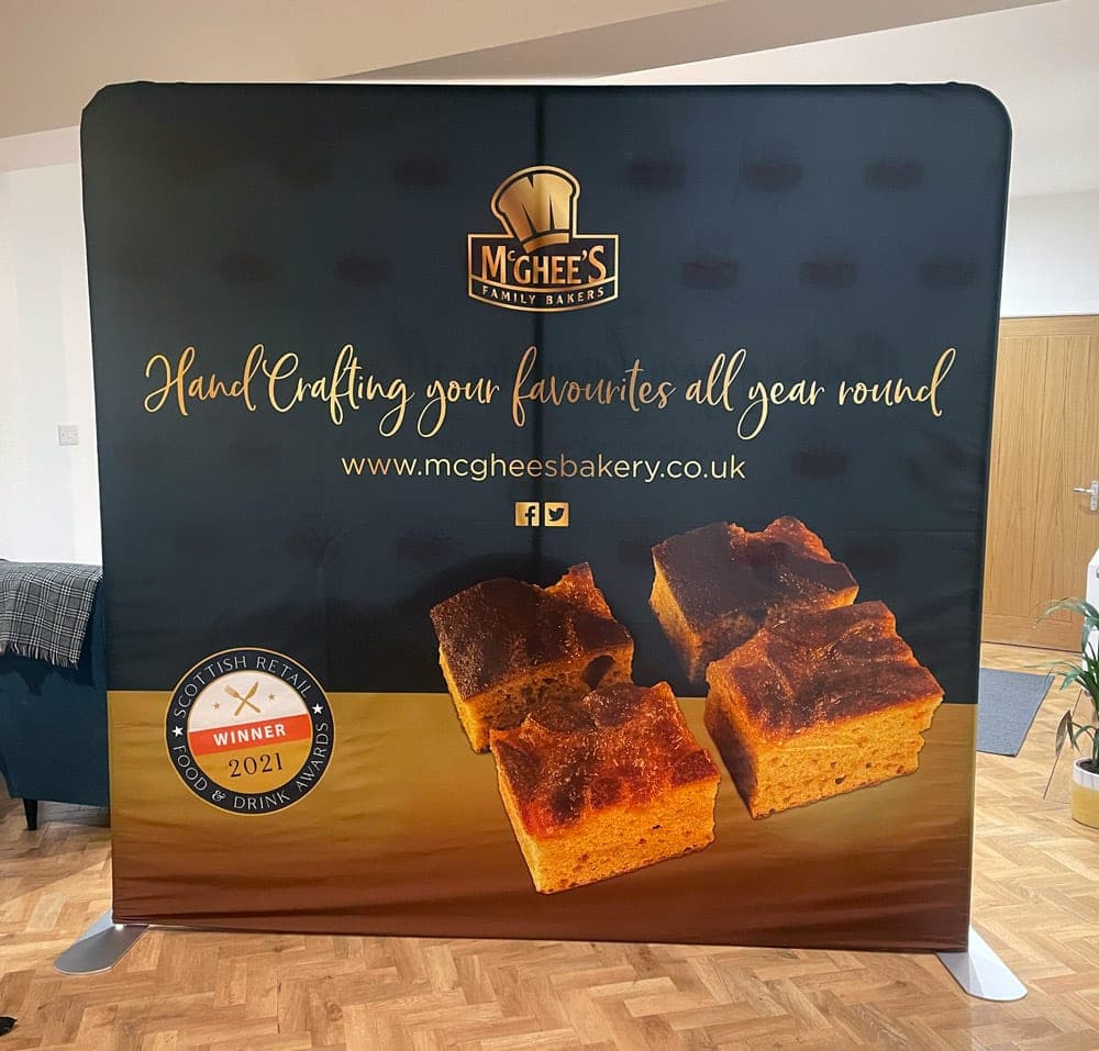 Dark McGhee’s fabric exhibition backdrop with traybakes