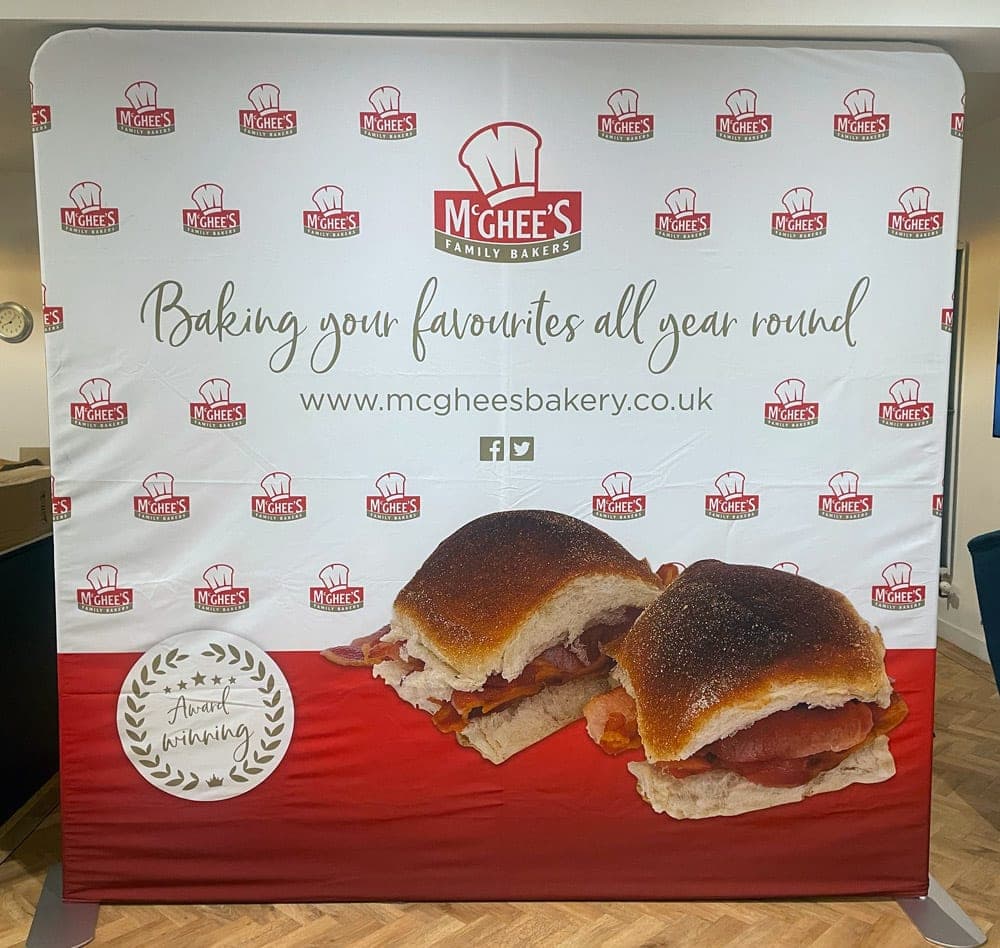 McGhee’s fabric exhibition backdrop reading Baking your favourites all year round