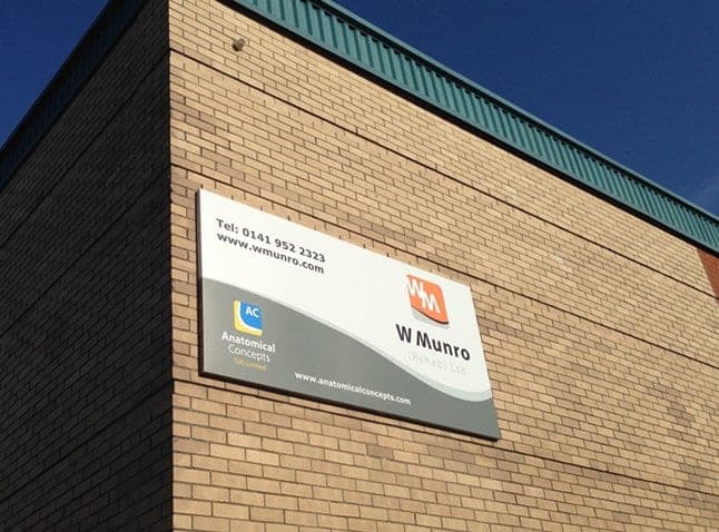 W Munro sign on a brick building