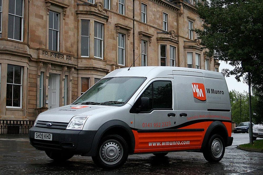 W Munro van with the new orange and red livery, after the rebrand